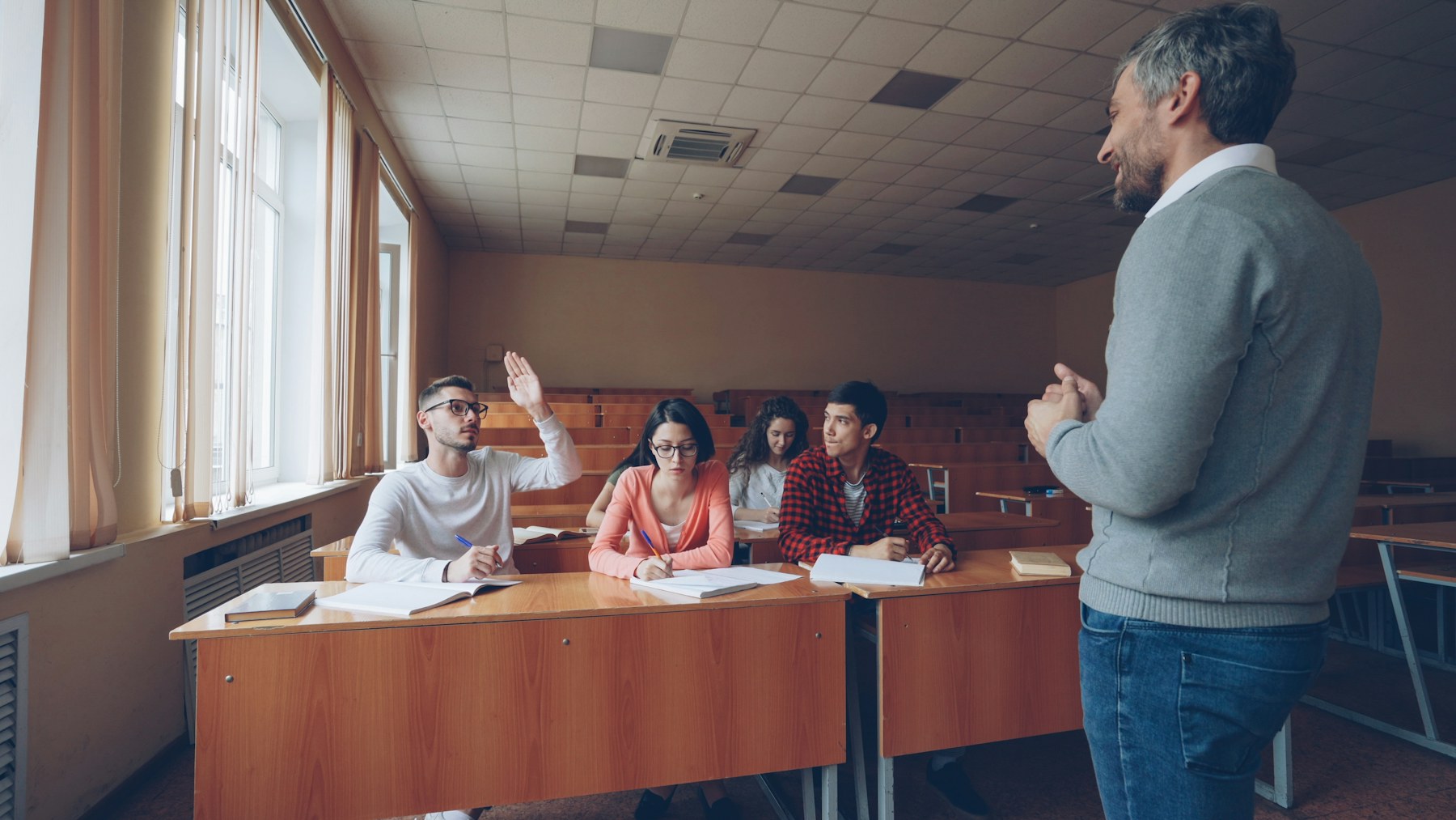 Students share ideas during a classroom discussion.